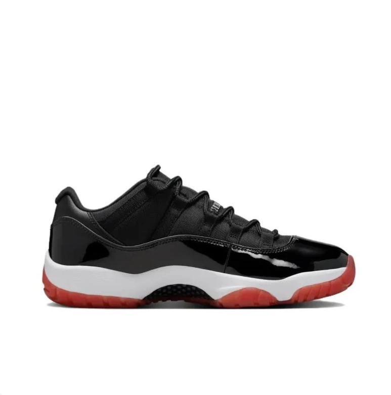 Air Jordan Black Low-Top Sneakers with Glossy Panels & Red Soles