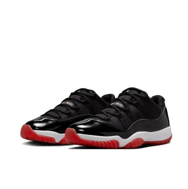 Air Jordan Black Low-Top Sneakers with Glossy Panels & Red Soles
