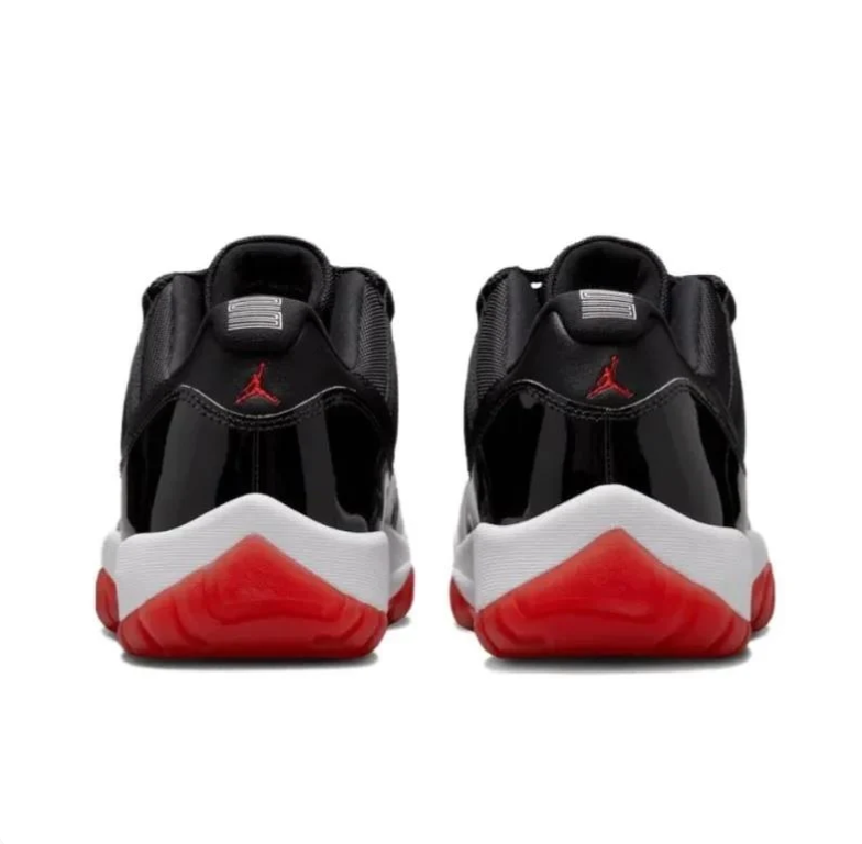 Air Jordan Black Low-Top Sneakers with Glossy Panels & Red Soles
